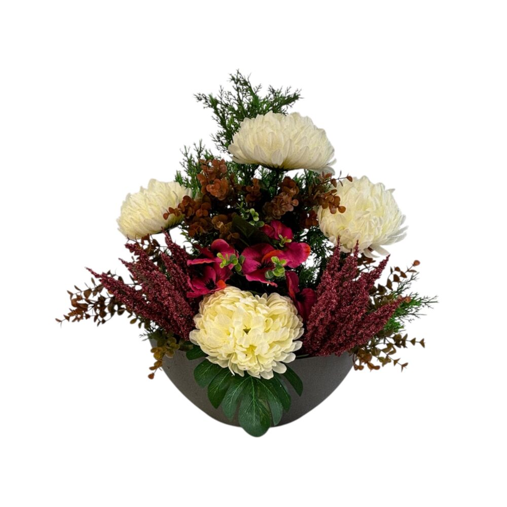 Toutes nos composition de Toussaint sont lestées au béton pour résister au vent.